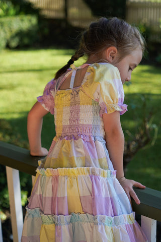 Pastel rainbow-colored dress with floral lace trim