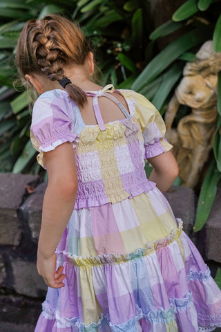 Pastel rainbow-colored dress with floral lace trim