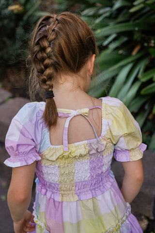 Pastel rainbow-colored dress with floral lace trim