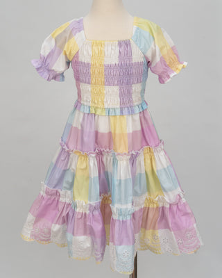Pastel rainbow-colored dress with floral lace trim