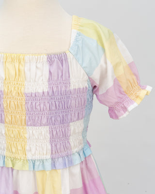 Pastel rainbow-colored dress with floral lace trim