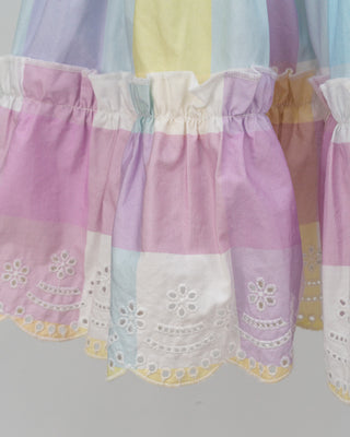 Pastel rainbow-colored dress with floral lace trim