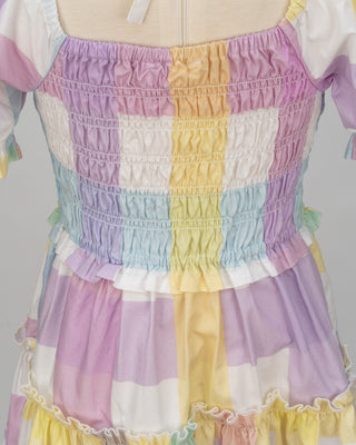 Pastel rainbow-colored dress with floral lace trim