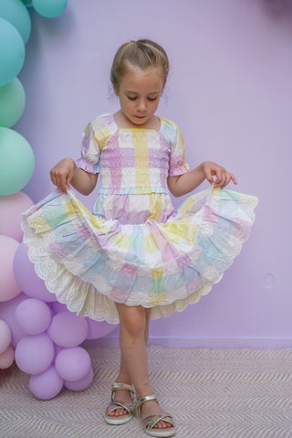 Pastel rainbow-colored dress with floral lace trim