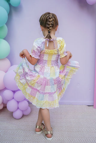 Pastel rainbow-colored dress with floral lace trim
