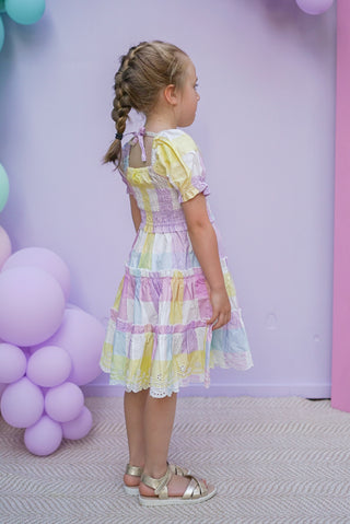 Pastel rainbow-colored dress with floral lace trim