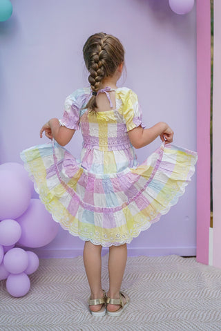 Pastel rainbow-colored dress with floral lace trim