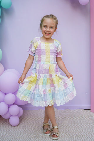 Pastel rainbow-colored dress with floral lace trim